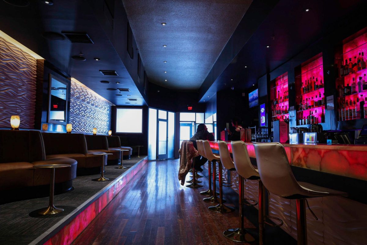 Anthem Bar in Champaign on Neil Street is peacefully illuminated from the light outside during a cold day on Sunday.