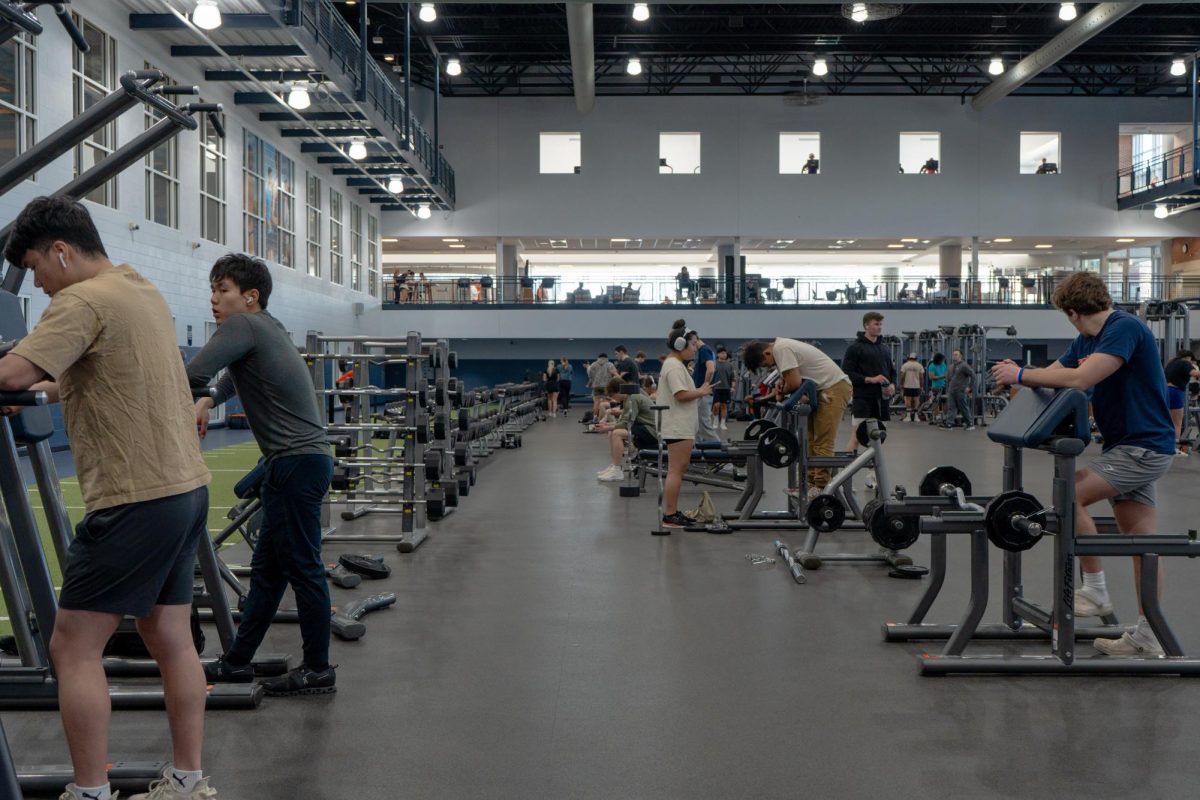 Students lift weights in the Activities and Recreation Center on East Peabody Drive on Feb. 26.