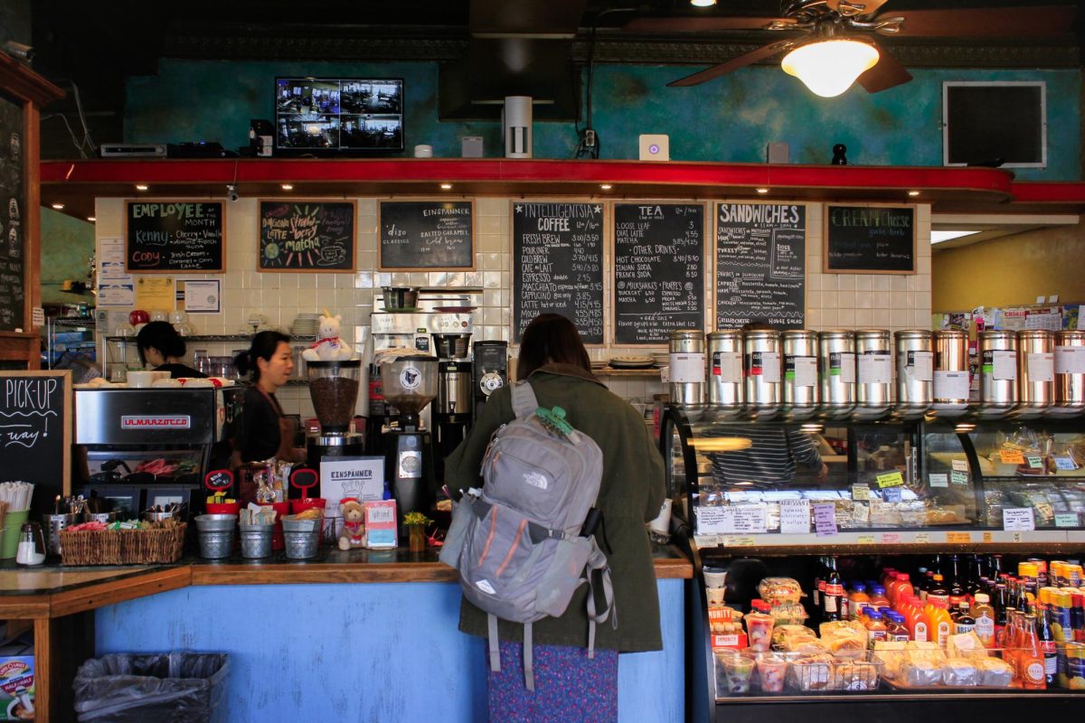 A customer waits for there order at the counter of Caffe Paradiso on Feb. 29.