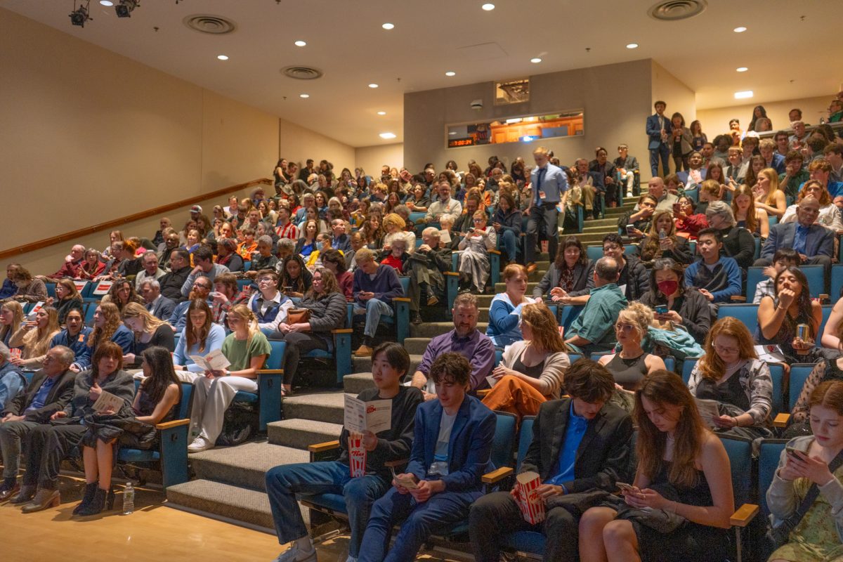 Guests file into the theater and await the showings of the films at the CU International Film Festival in the Spurlock museum on Saturday.