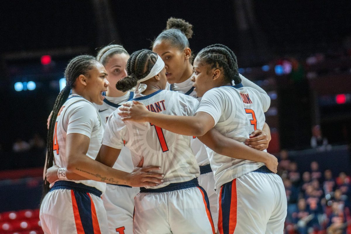 Illinois women’s basketball team come together after a quick call made by the red early in the first quarter on Mar. 24. 