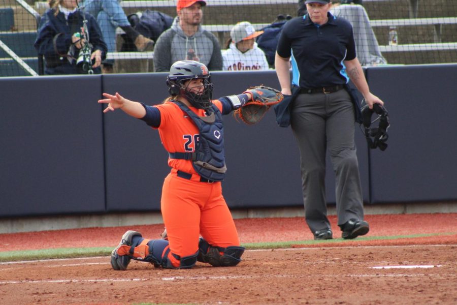 Utility Paige Berkmeyer gives a signal during a warmup throw on Mar. 29, during a game opposing Indiana State.
Berkmeyer shares the impact playing for the Illini has brought to her up to her two year being a part of the team.