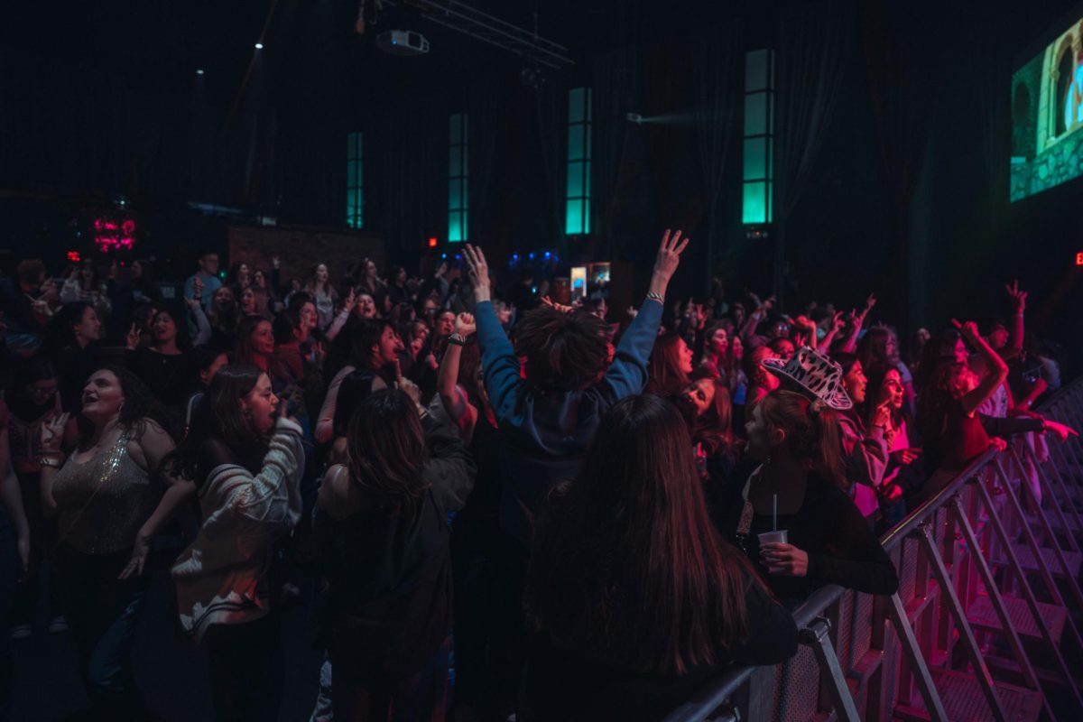 An energetic crowd enjoys a Taylor Swift song at Canopy Club, located on South Goodwin Avenue, on Feb. 2.