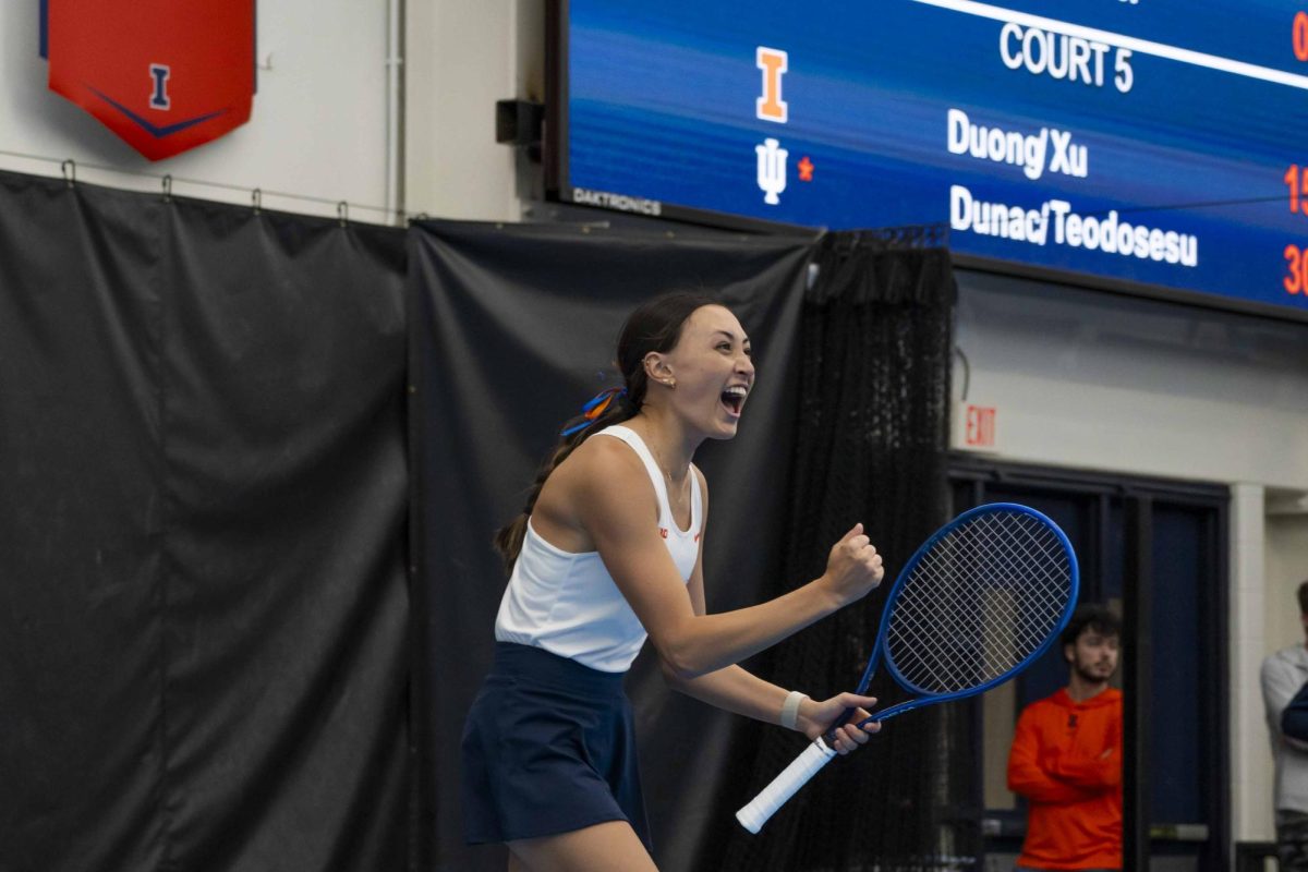 Junior Kida Ferrari celebrates winning a point against Indiana on Friday, April 12 in Atkins Tennis Center.