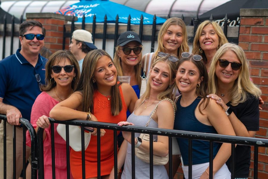 A group of friends and families waited in line together.