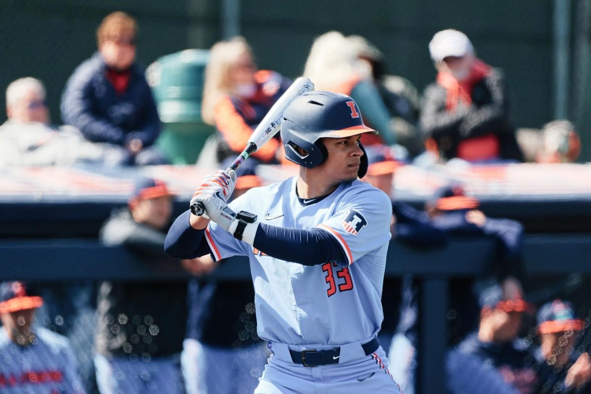 Outfielder Connor Milton winds up moments before hitting a massive home run for four points with two bases loaded on Sunday.
