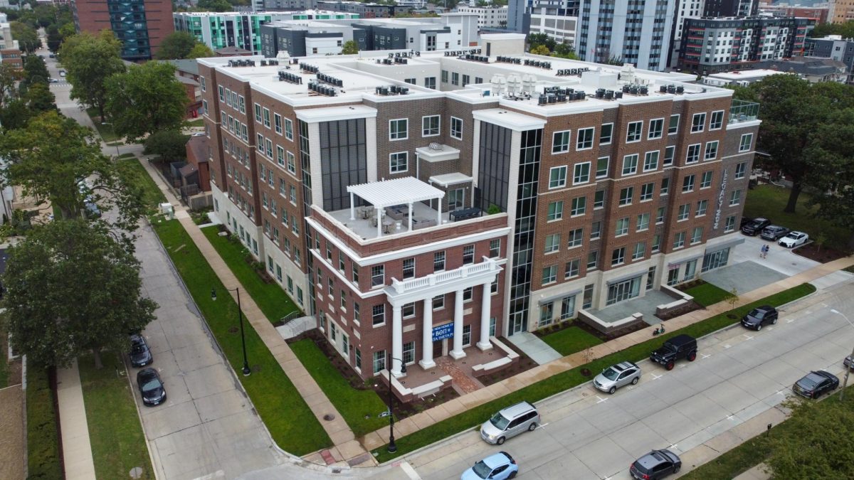 Legacy 202, a luxury apartment complex on the corner of Second and Daniel streets, stands tall on an overcast day. The complex also includes the new house of the Beta Theta Pi fraternity.