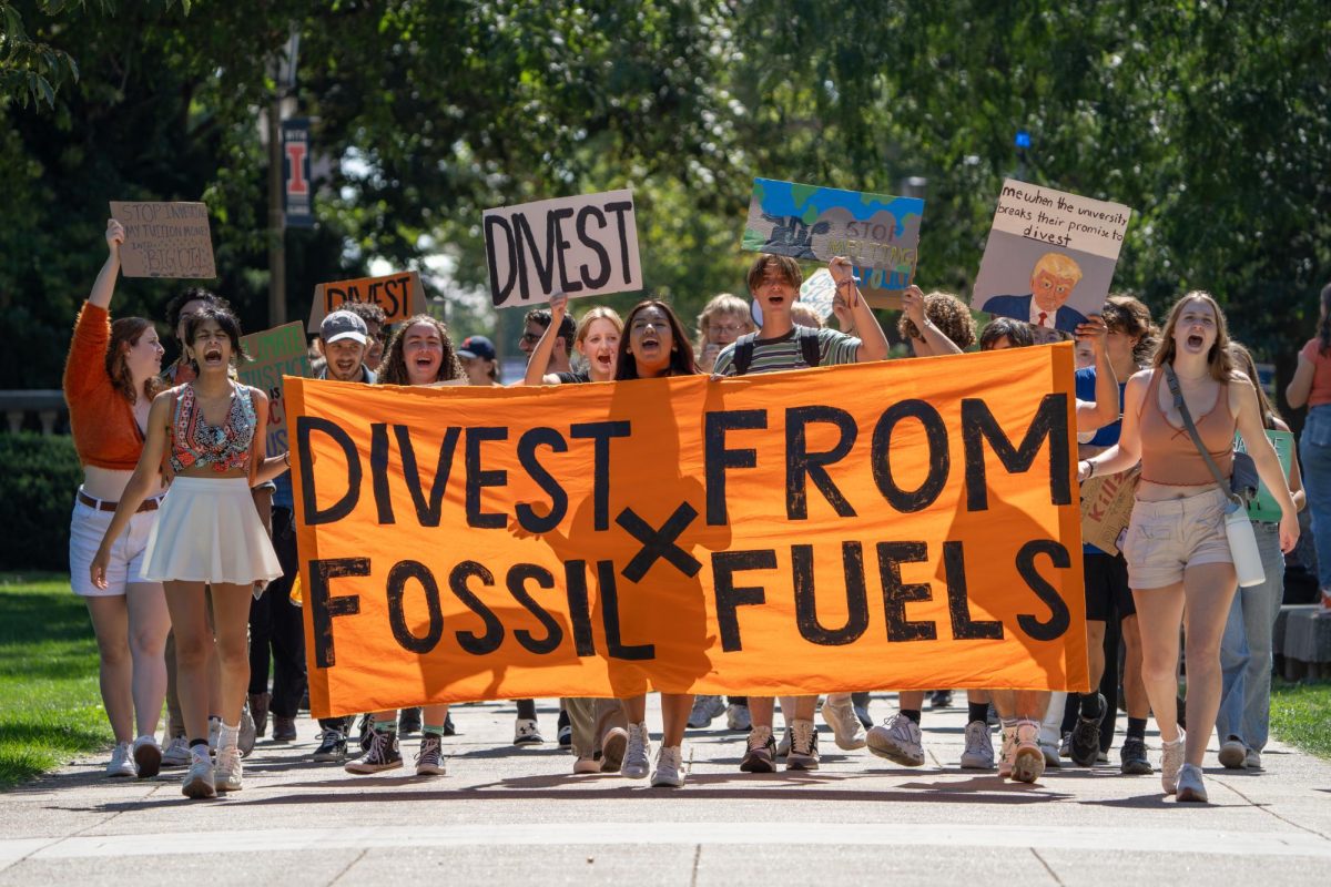 Protestors march through the Main Quad during the Students for Environmental Change climate protest on Friday.