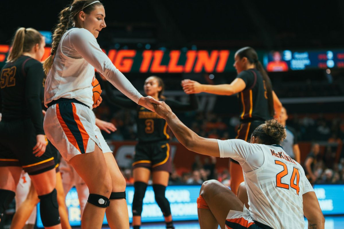 Senior Forward Kendall Bostic lifts Junior Guard Adalia McKenzie following a play on Jan. 28.