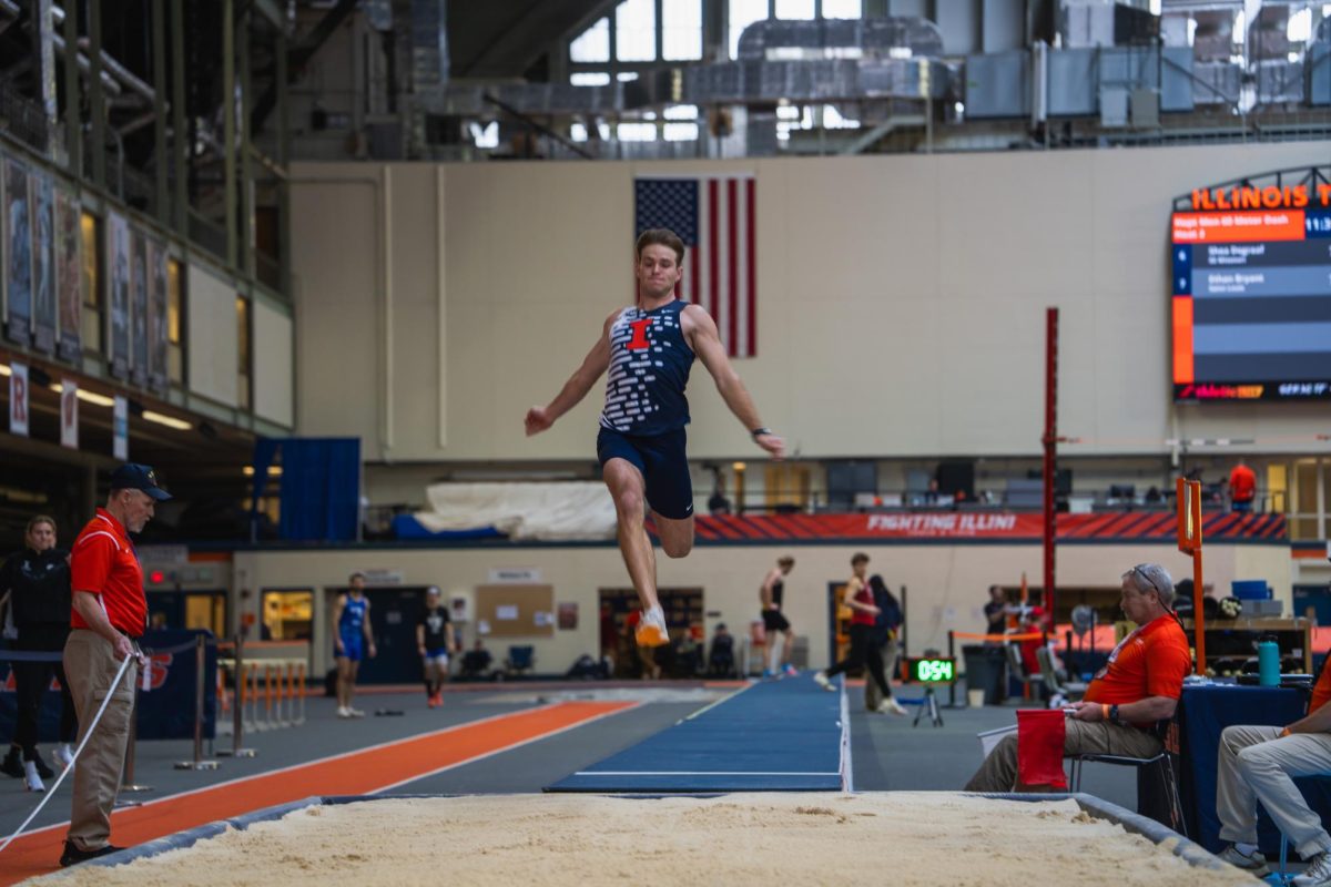 Senior Aiden Ouimet long jumps during the Illini Challenge on Jan. 26.