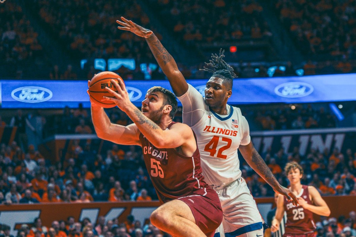 Redshirt Junior Dain Dainja blocks a shot during the second half against Colgate on Dec. 17. Dainja led Illinois in points with 19 against Fairleigh Dickinson on Friday.