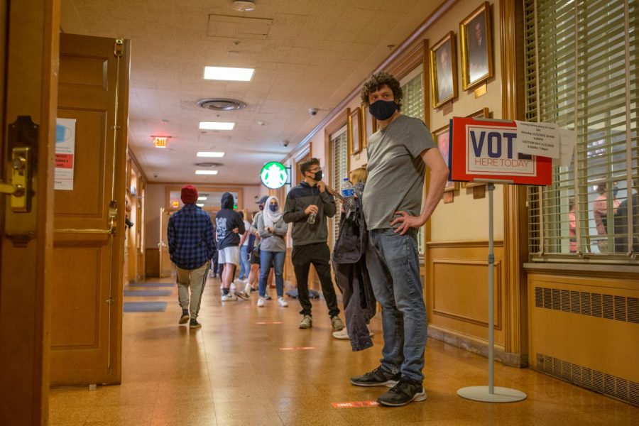 Students stand in line to vote at the Illini Union polling place on Tuesday.