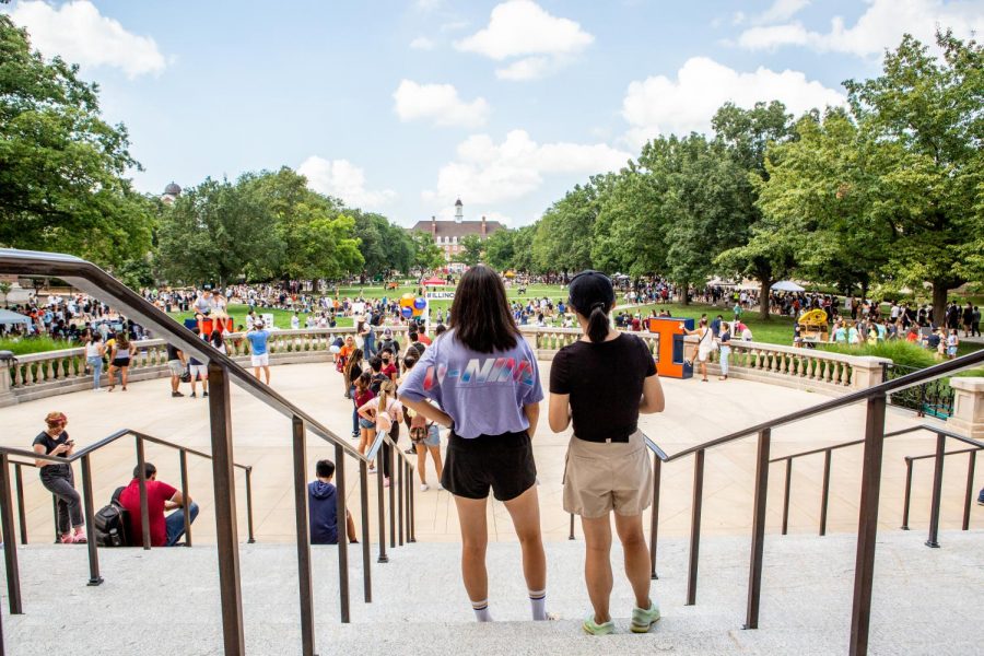 Two students look to the Main Quad at all of the RSO booths during Quad Day on Aug. 22. University students have made changes to their school careers during the pandemic by switching majors and life directions.