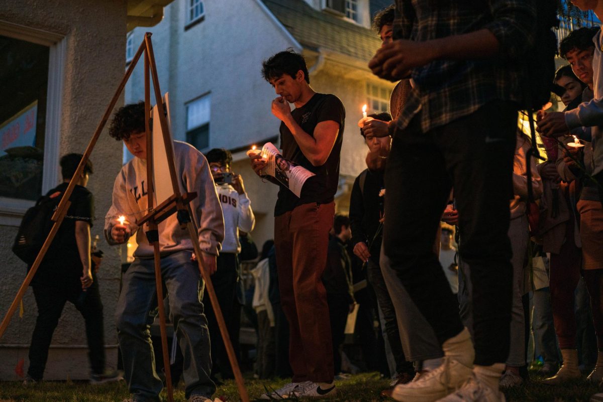 During a vigil on Friday, the campus community and loved ones of Akul Dhawan lay flowers and candles at the 1200 block of West Nevada Street where Dhawan’s remains were located. 