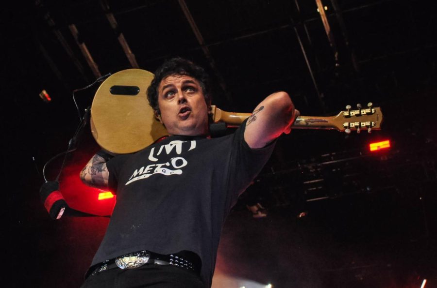 Billie Joe Armstrong, lead, vocalist of Green Day, plays a guitar from behind without looking on the T-Mobile stage on Saturday. Other artists featured on the last day are J-Hope, Djo and more.  