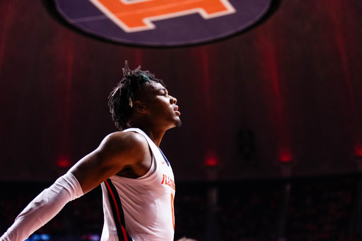 Guard Terrence Shannon Jr. takes a moment to briefly stretch his arms on the court during a game against Eastern Illinois on Nov. 6.