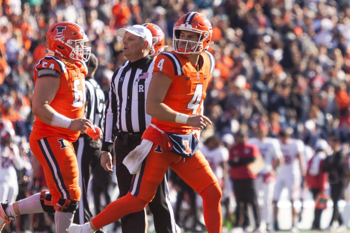 Quarterback John Paddock runs to the center of the field on Nov. 11.