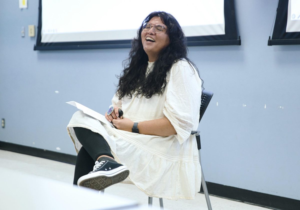 Indigenous scholar Charlie Amáyá Scott laughs while presenting at the College of Education on Nov. 30.  