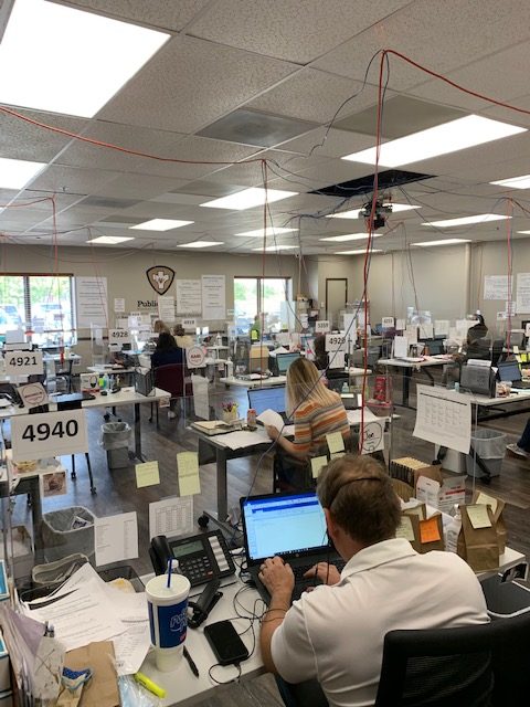 Employees work at their computers in the Champaign-Urbana Public Health District’s operations center. CUPHD conducts the vast majority of contact tracing in the area.