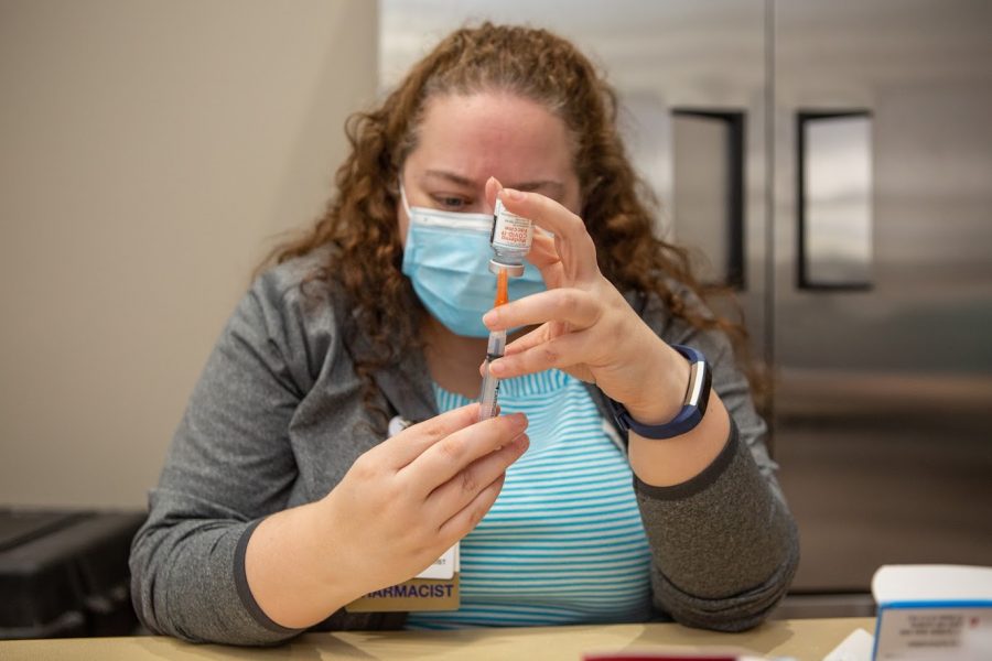 Pharmacist Katie Lampan prepares shots of the Moderna COVID-19 vaccine on Jan. 12. Vaccine supplies are currently limited to older and at-risk citizens.