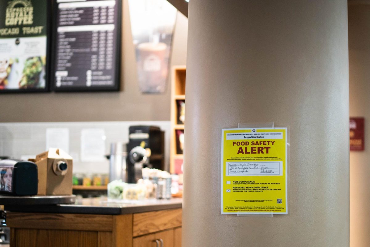 Food safety warning posted on a pillar outside of the Espresso Royale located within the Grainger Engineering Library on Monday afternoon.