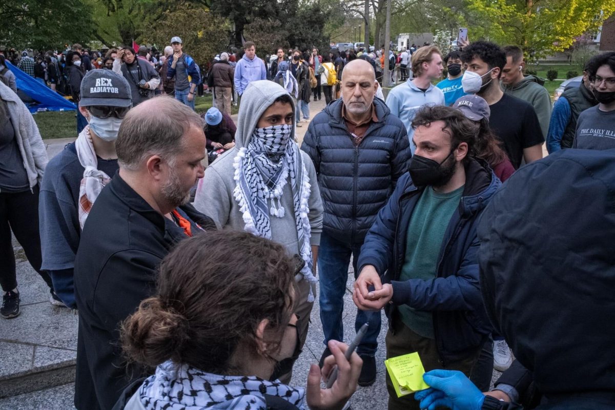 SJP members and Vice Chancellor Jim Hintz discuss terms for a negotiation to find a peaceful solution.