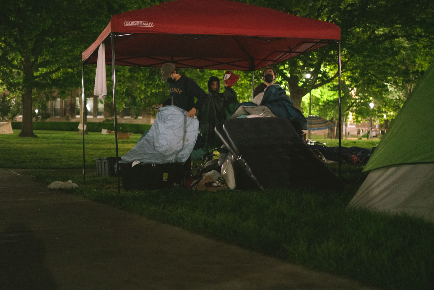 Protesters gather their belongings before moving to The Red Herring on Friday.