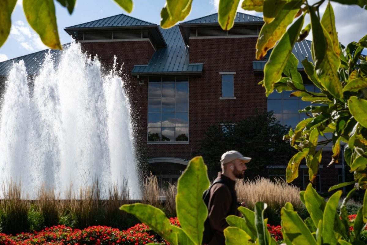 The sun shines on the Office of Undergraduate Admissions building located at 901 W. Illinois St, Urbana on Monday afternoon shortly after the fountain turns on.