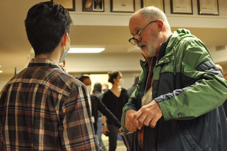 Illini Media alum, Mark Wukas, speaks with assistant sports editor James Kim during the newsroom and studio tour for the Illini Media 150 Reunion on Friday. Alumni from The Daily Illini and WPGU talk about their favorite memory during their time with Illini Media. 