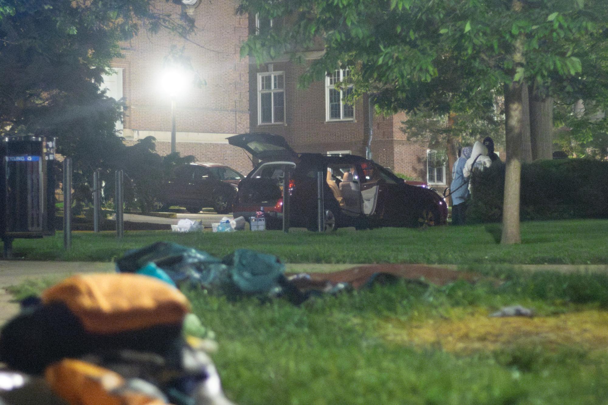 Protesters load all the medical equipment to a vehicle parked near Foellinger Auditorium on Friday morning.