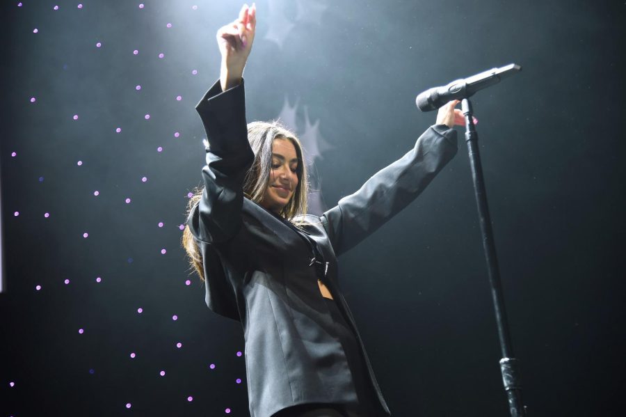 Charli XCX performs onstage during the iHeartRadio Z100 Jingle Ball 2021 Pre-Show on Dec. 10, 2021. The artist performed at Lollapalooza singing Lighting, I Love It and more on Sunday. The photo pit was closed for Charli XCXs Lollapalooza performance. 