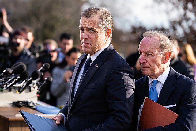 Hunter Biden (left) and Abbe Lowell (right) surrounded by reporters asking about Biden’s potential testimony before the House of Representatives about his foreign business dealings.