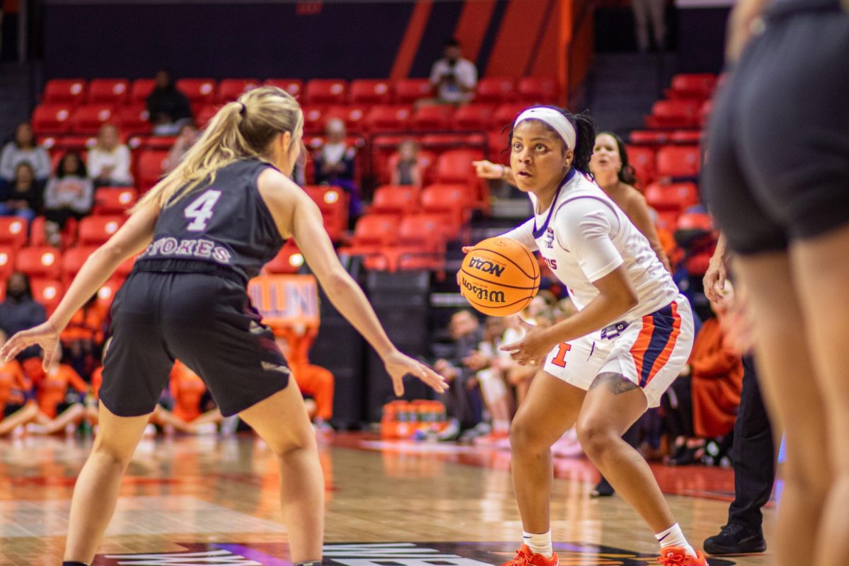 Senior Guard Makira Cook surges past Missouris defense in the first half, drawing a foul with her offensive drive on Thursday.