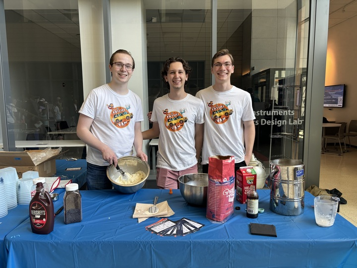 Will Vargo, Henry Bonzak, Christian Pytel make liquid nitrogen ice cream on World Quantum Day for The Physics Van, a science demonstration. 