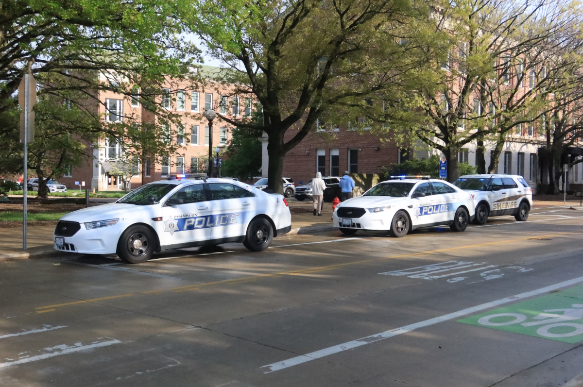 Champaign+Police+squad+cars+parked+on+April+26.+CPD+responded+to+a+shooting+overnight+that+injured+two.+