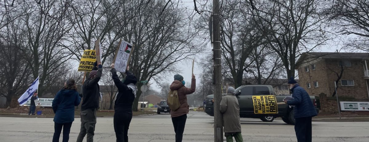 Before marching through the University campus, attendees lined the Kirby Avenue side of Hessel Park, participating in chants and holding signs.
