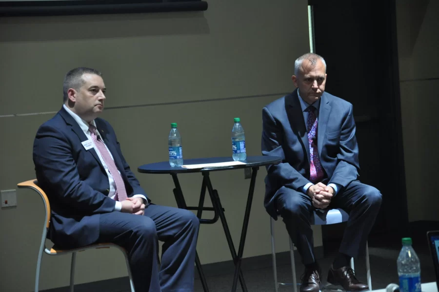 Champaign county sheriff candidates, Democrat Dustin Heuerman (left) and Republican John Brown (right), answer questions at a forum held in the ARC’s Clements Auditorium on Oct. 26. 