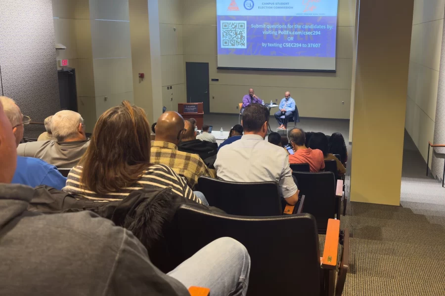 People attend the Champaign County Clerk forum featuring Democrat Aaron Ammons and Republican Terrence Stuber on Oct. 25. 